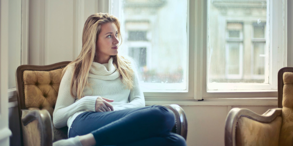 woman on a chair looking pensive