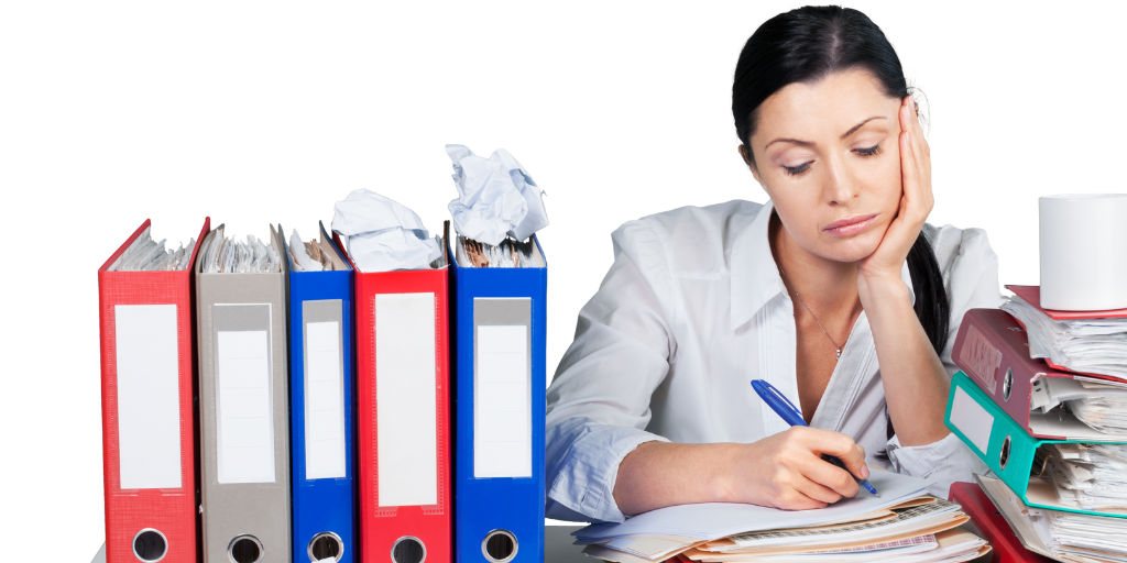 A woman surrounded by paperwork