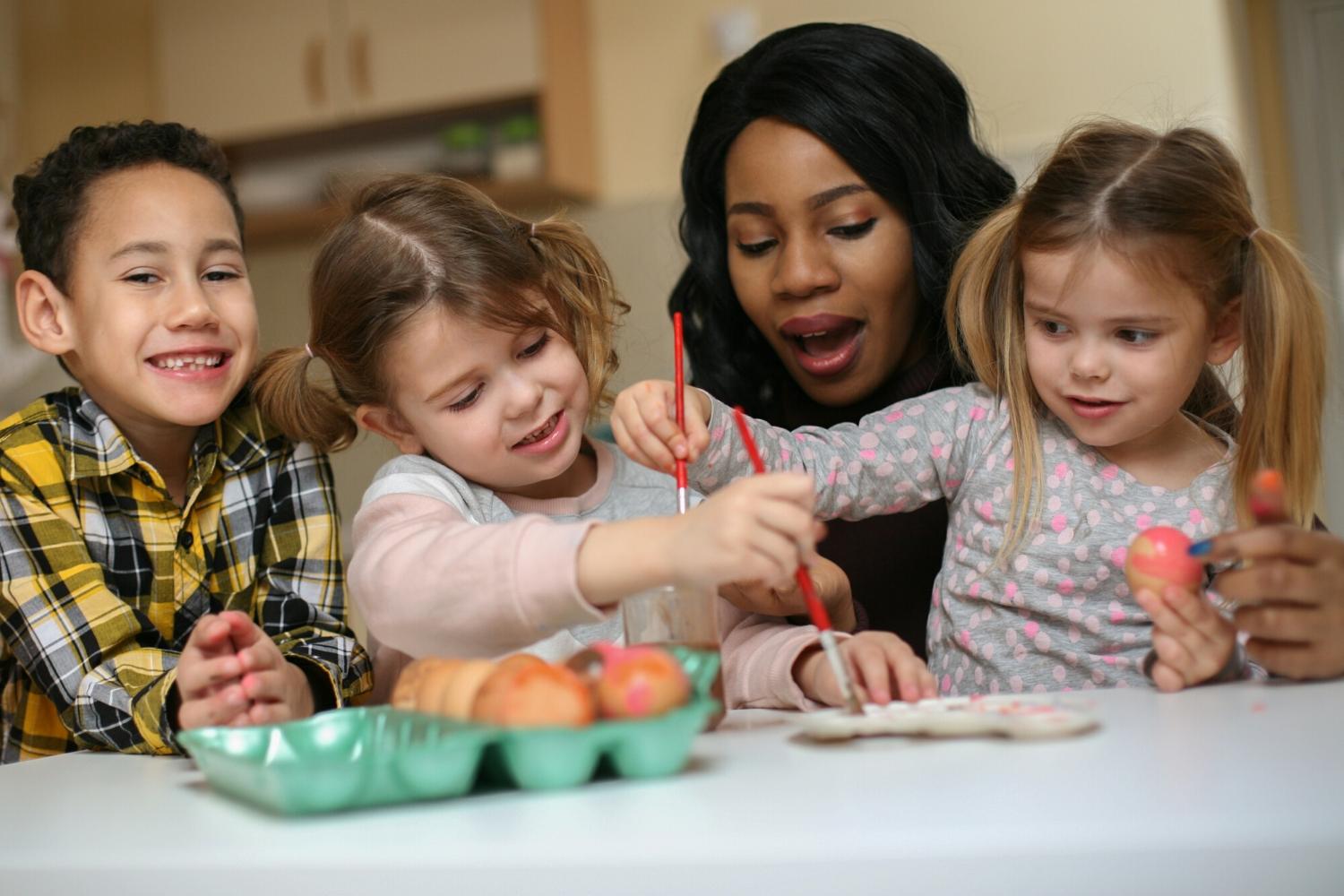 Childminder with doing an activity with children