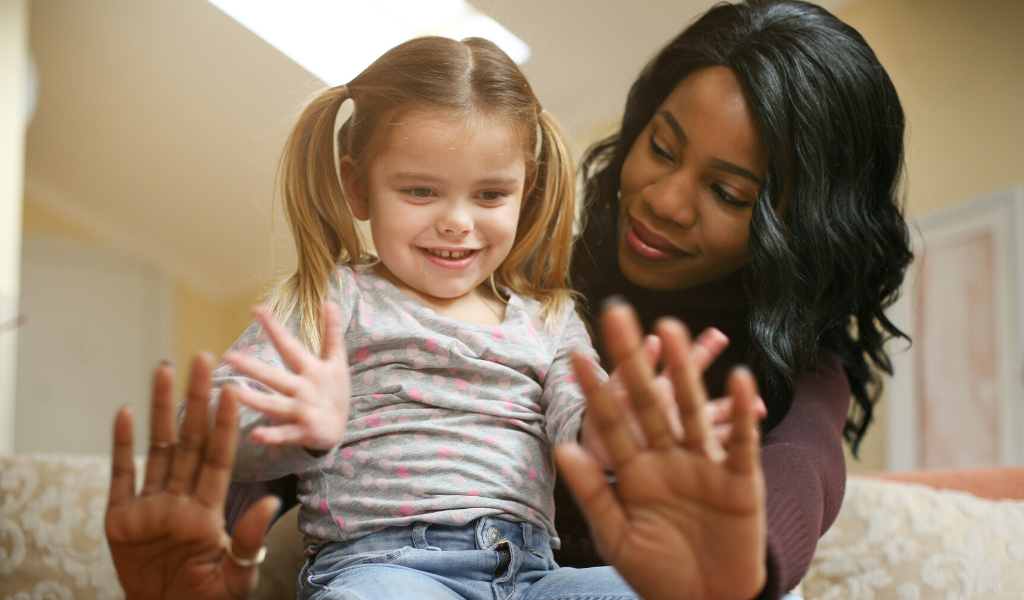 childminder playing with a child