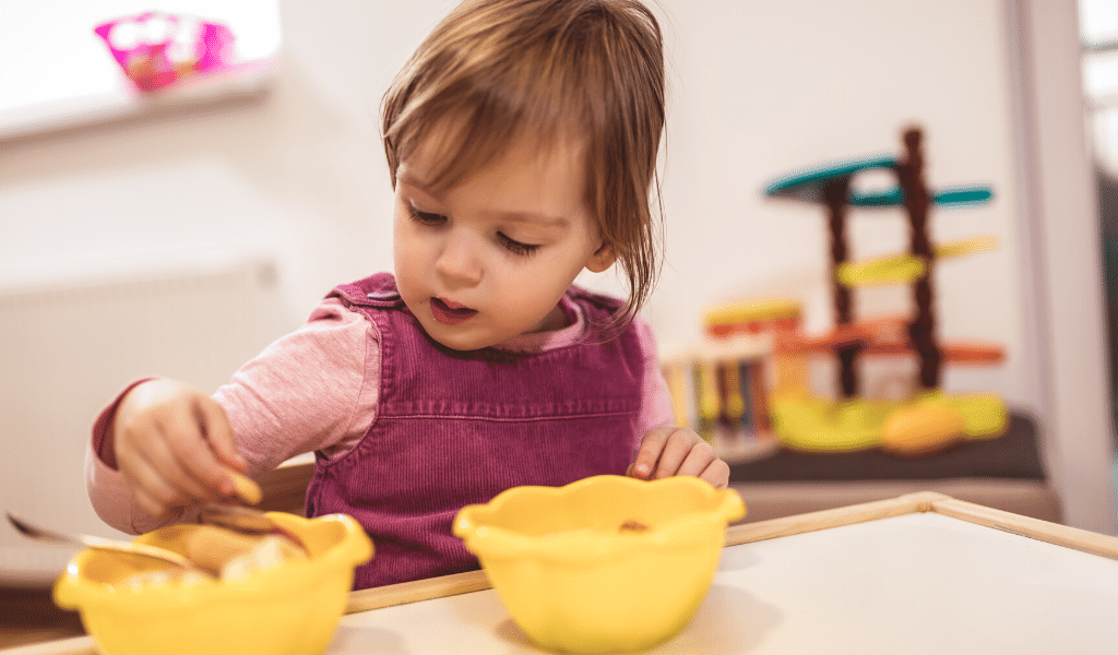 baby eating food at nursery
