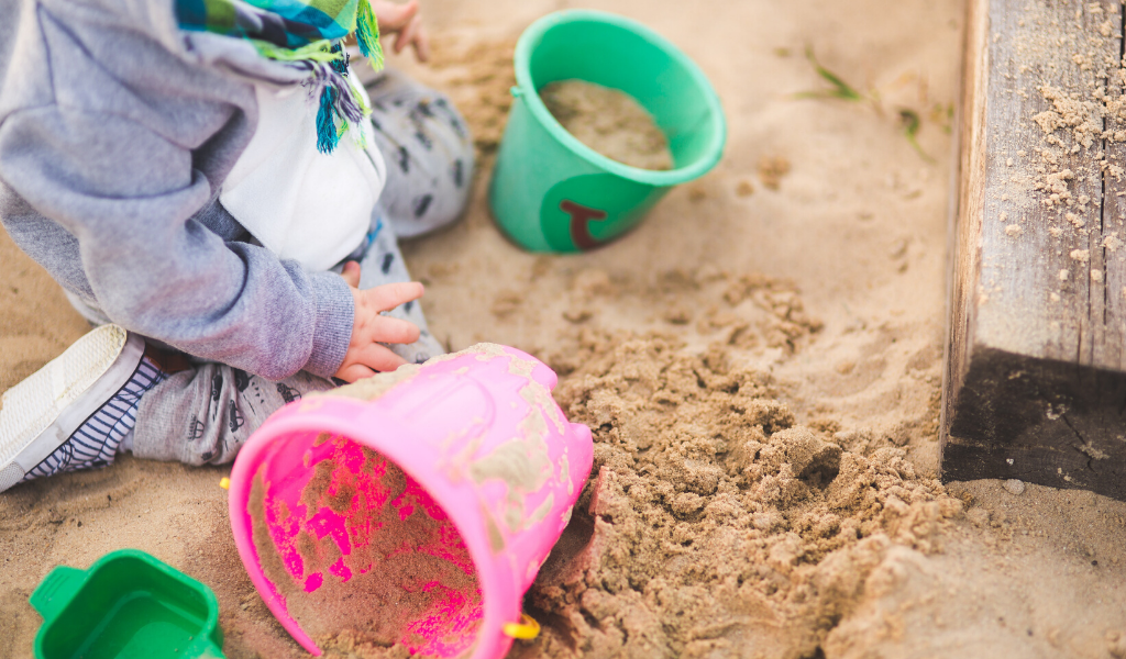 child playing with sand