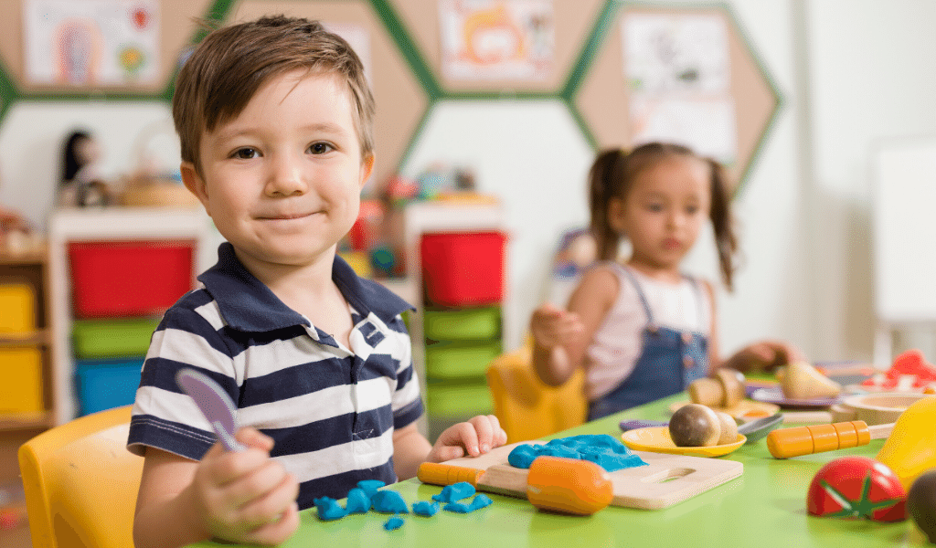 children at nursery playing with toys