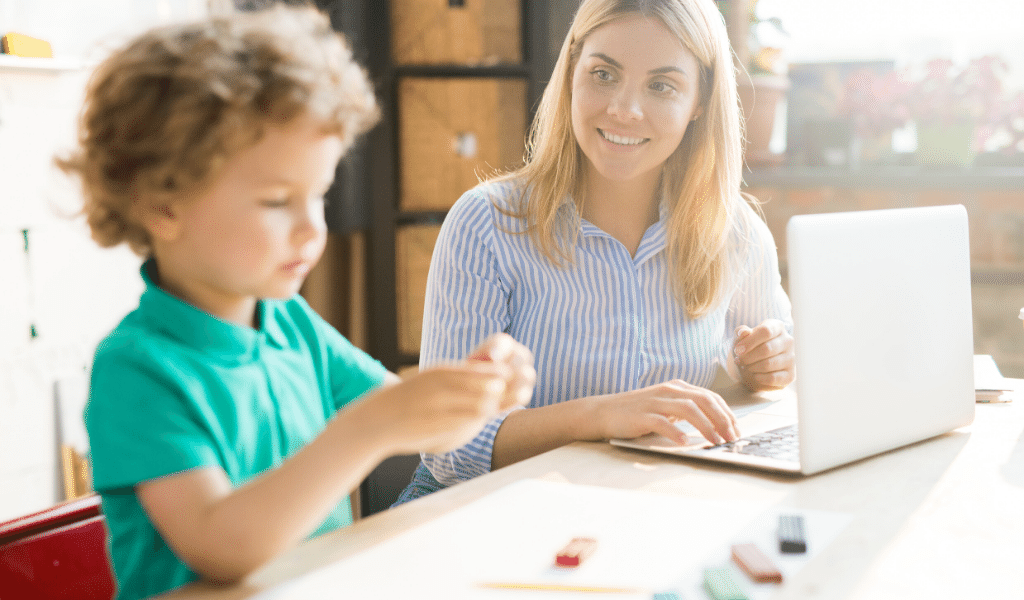 woman with laptop and child