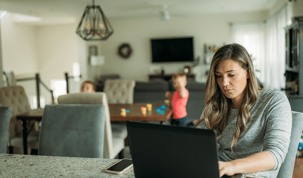 Woman working on laptop at home