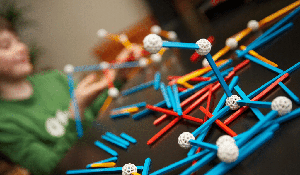 boy playing with science tools