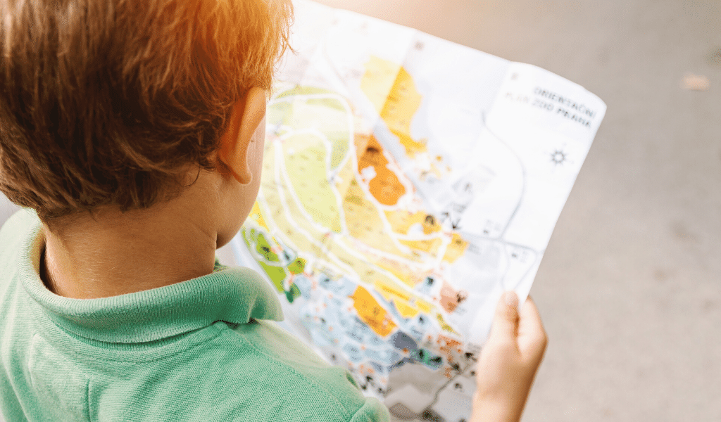 child reading a map