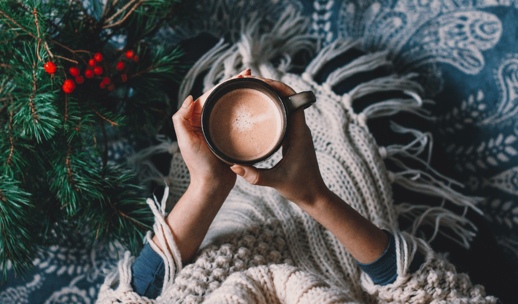 woman holding a cup of hot chocolate