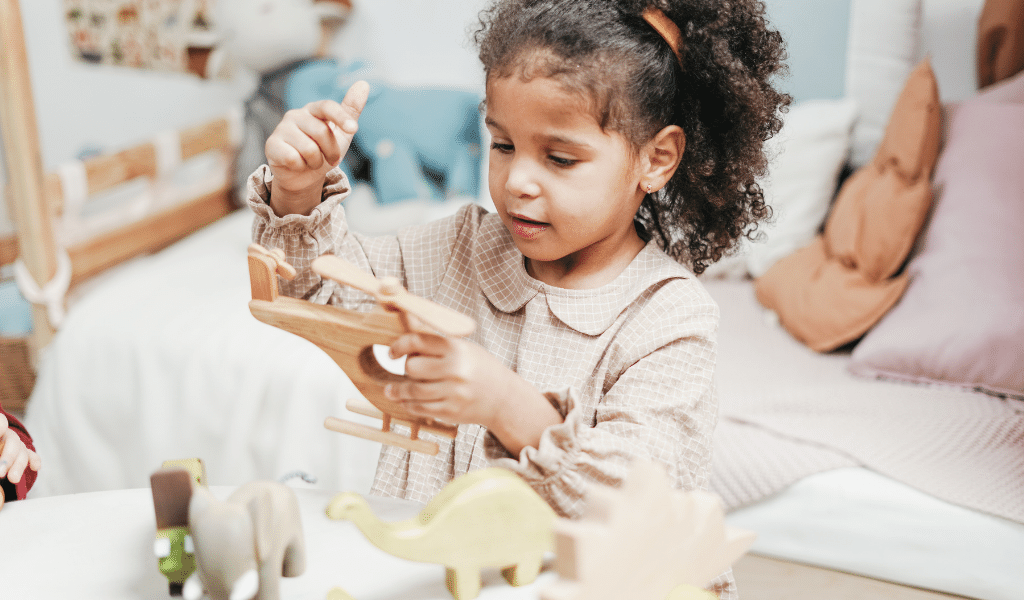 black girl playing with toys