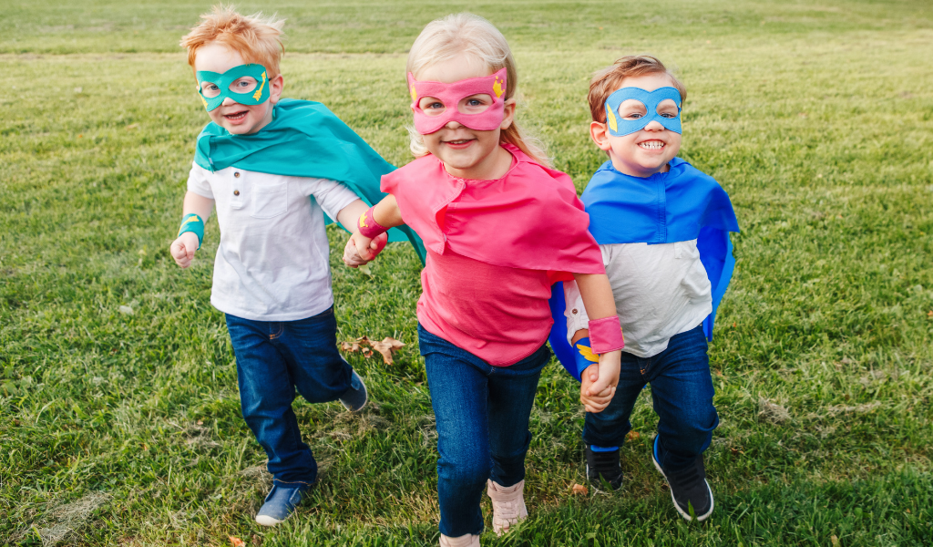 children dressed as superheroes