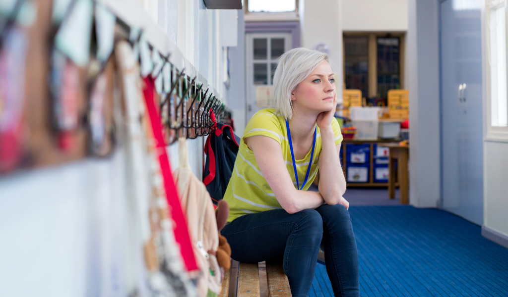 childminder waiting in nursery hallway