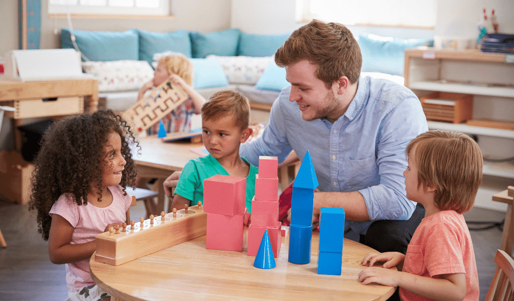 childminder in a montessori setting talking to children