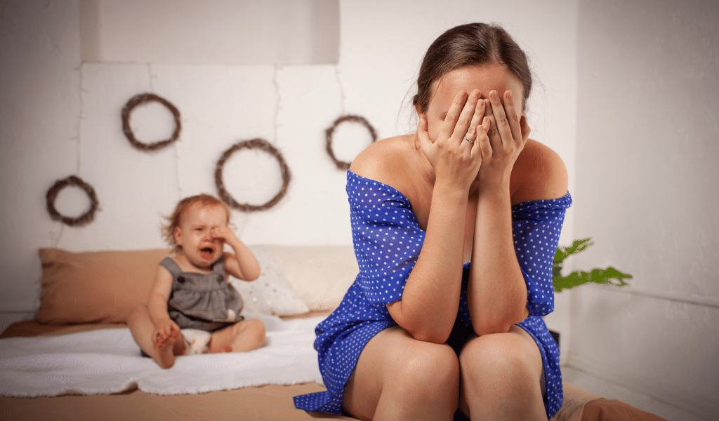 childminder exhausted from baby's tantrum