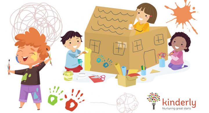 children playing with paint and cardboard