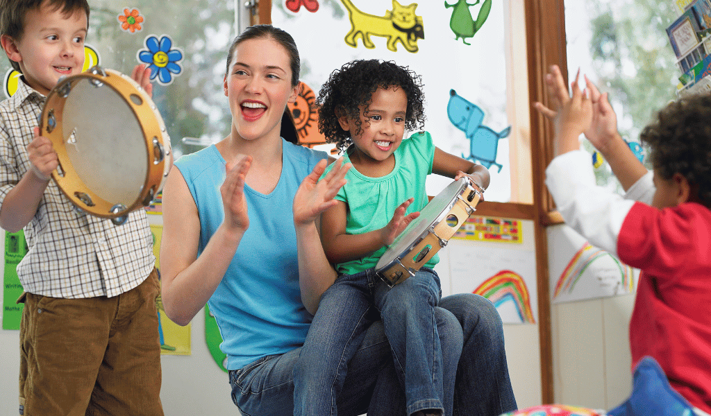 childminder playing musical instruments with children